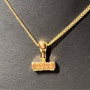 Vintage Avon LOVE SEAL PENDANT NECKLACE. rubber stamp!  New. Gold tone.